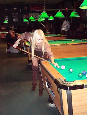 Playing pool in skirt